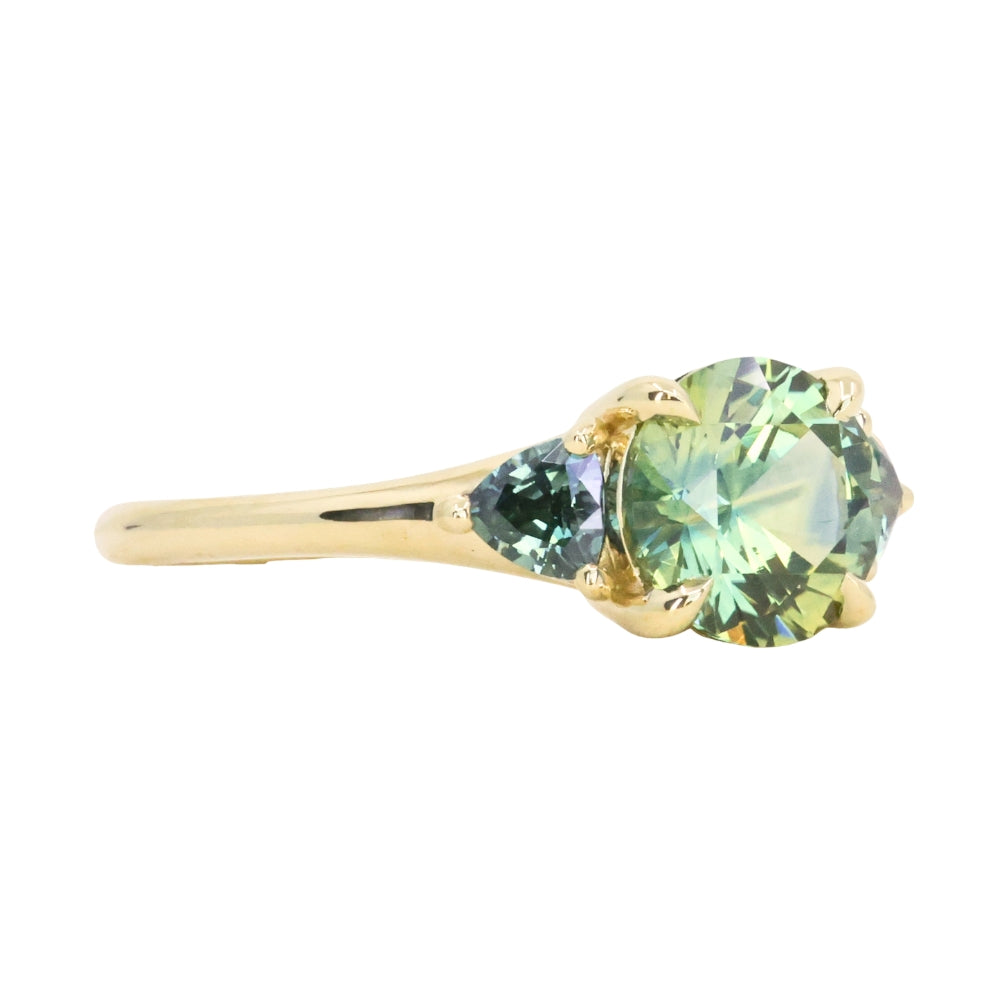1.50ct Round Parti Yellow Blue Precision Cut Montana Sapphire and Trillion Sapphire Low Profile Three Stone Ring in 18k Yellow Gold