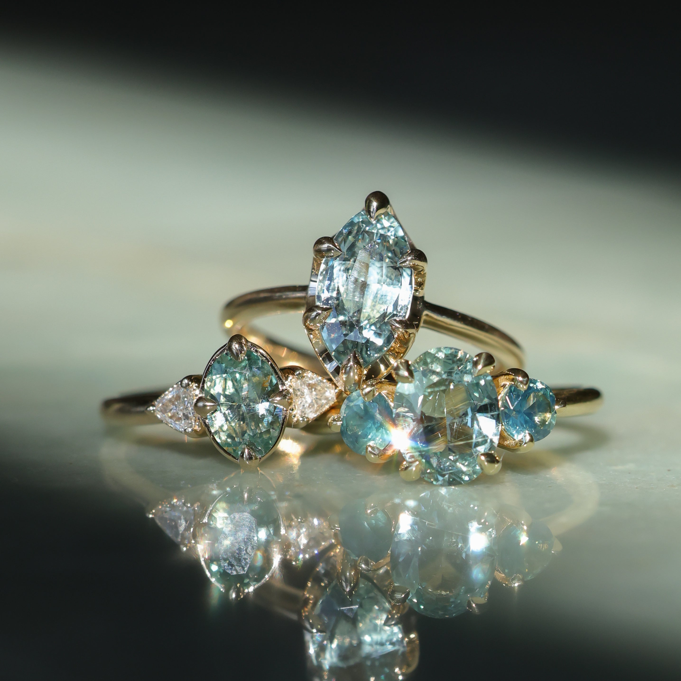 1.74ct Unheated Oval Montana Sapphire and Madagascar Sapphire Low Profile Three Stone Ring in 18k Yellow Gold