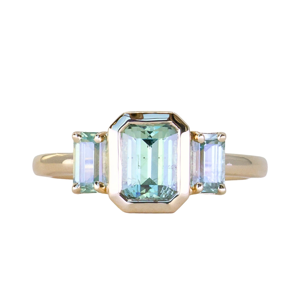 1.29ct Bezel Set Emerald Cut Untreated Montana Sapphire and Montana Sapphire Sides Three Stone Ring in 14k Yellow Gold