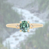 0.90ct Oval Light Blue Green Montana Sapphire and Princess Cut Diamond Rapids Low Profile Ring in 14k Yellow Gold