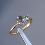 1.52ct Grey Oval Diamond and 0.28ct Round Montana Sapphire Ring in 14k Yellow Gold