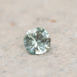 0.77CT ROUND BRILLIANT MONTANA SAPPHIRE, WHITE AND SOFT SEAFOAM GREEN, 5.5X1.00MM