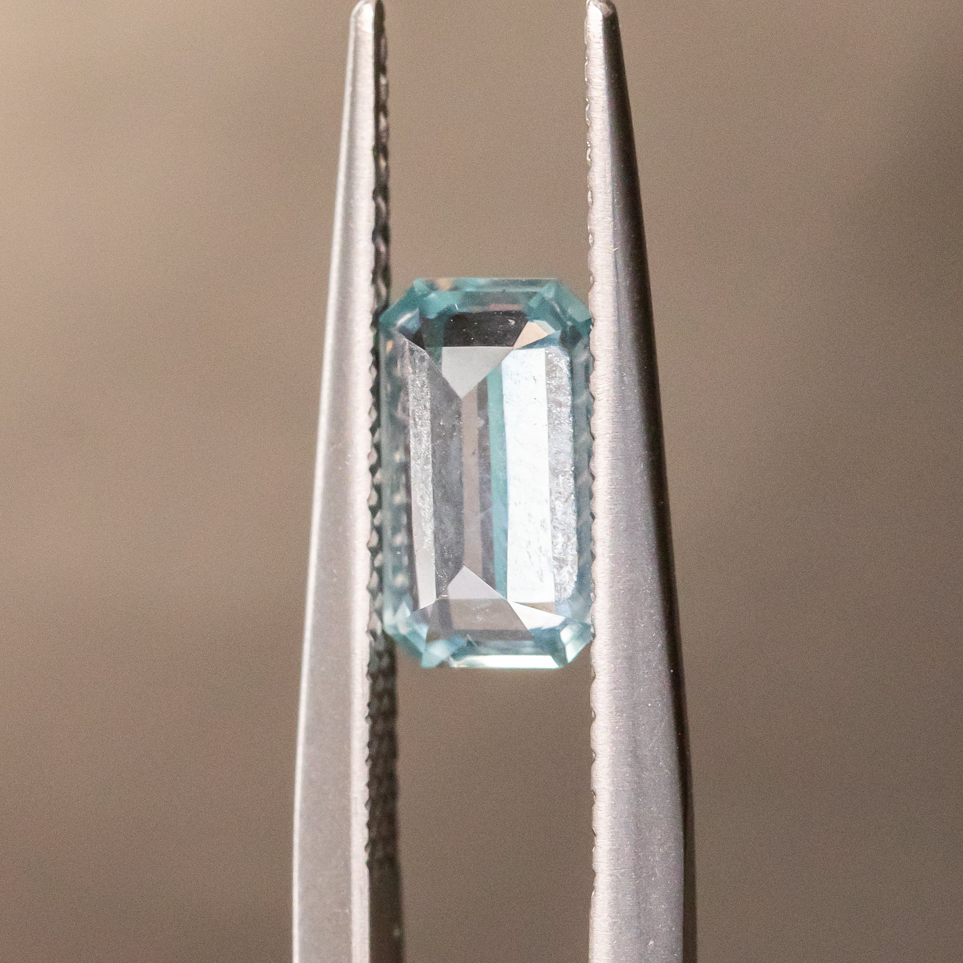 1.22CT EMERALD CUT MONTANA SAPPHIRE, ICEY BLUE GREY, 8X4.5X4MM