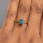 1.63ct Oval Montana Sapphire Evergreen Carved Solitaire in 18k Yellow Gold