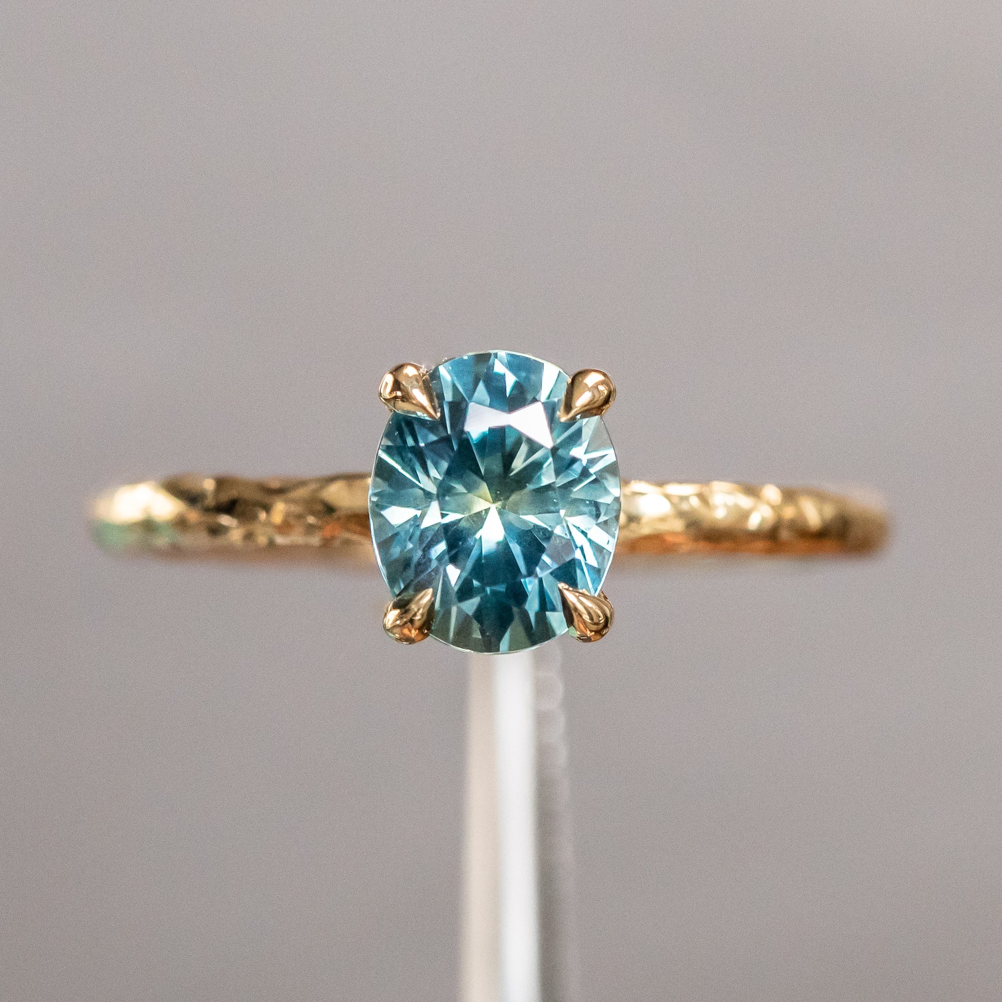 1.63ct Oval Montana Sapphire Evergreen Carved Solitaire in 18k Yellow Gold