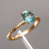 1.63ct Oval Montana Sapphire Evergreen Carved Solitaire in 18k Yellow Gold