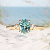1.35ct Oval Brilliant Montana Sapphire and Princess Cut Diamond Rapids Low Profile Ring in 14k Yellow Gold