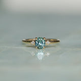 0.90ct Oval Light Blue Green Montana Sapphire and Princess Cut Diamond Rapids Low Profile Ring in 14k Yellow Gold
