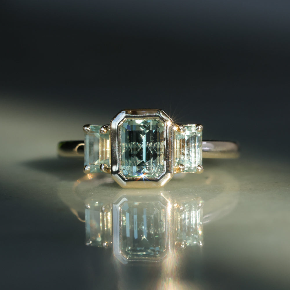 1.29ct Bezel Set Emerald Cut Untreated Montana Sapphire and Montana Sapphire Sides Three Stone Ring in 14k Yellow Gold