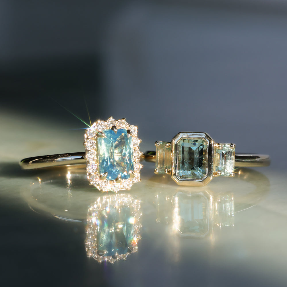 1.29ct Bezel Set Emerald Cut Untreated Montana Sapphire and Montana Sapphire Sides Three Stone Ring in 14k Yellow Gold