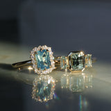 1.29ct Bezel Set Emerald Cut Untreated Montana Sapphire and Montana Sapphire Sides Three Stone Ring in 14k Yellow Gold
