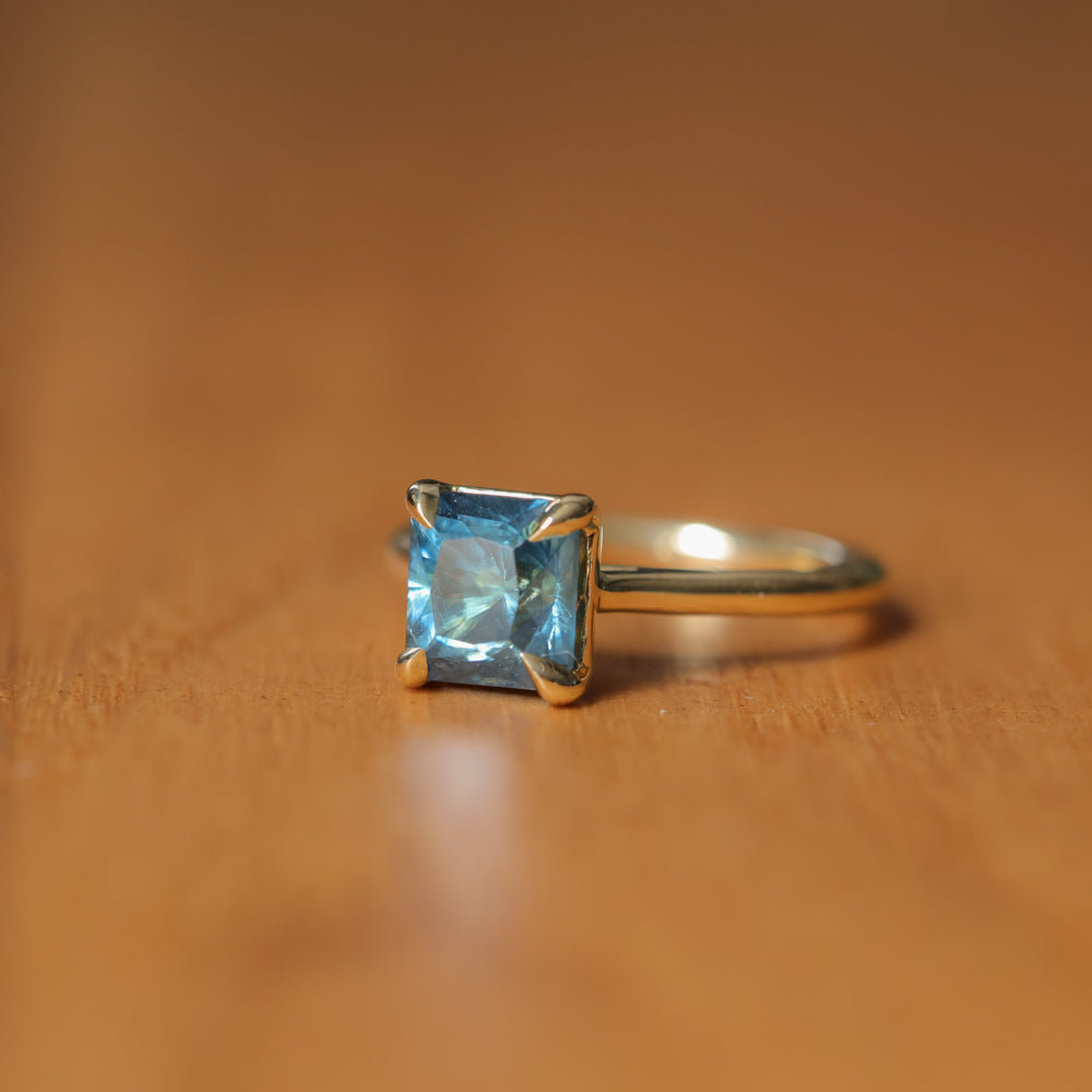 2.67ct Untreated Radiant Cut Montana Sapphire Four Prong Cathedral Solitaire in 18k Yellow Gold