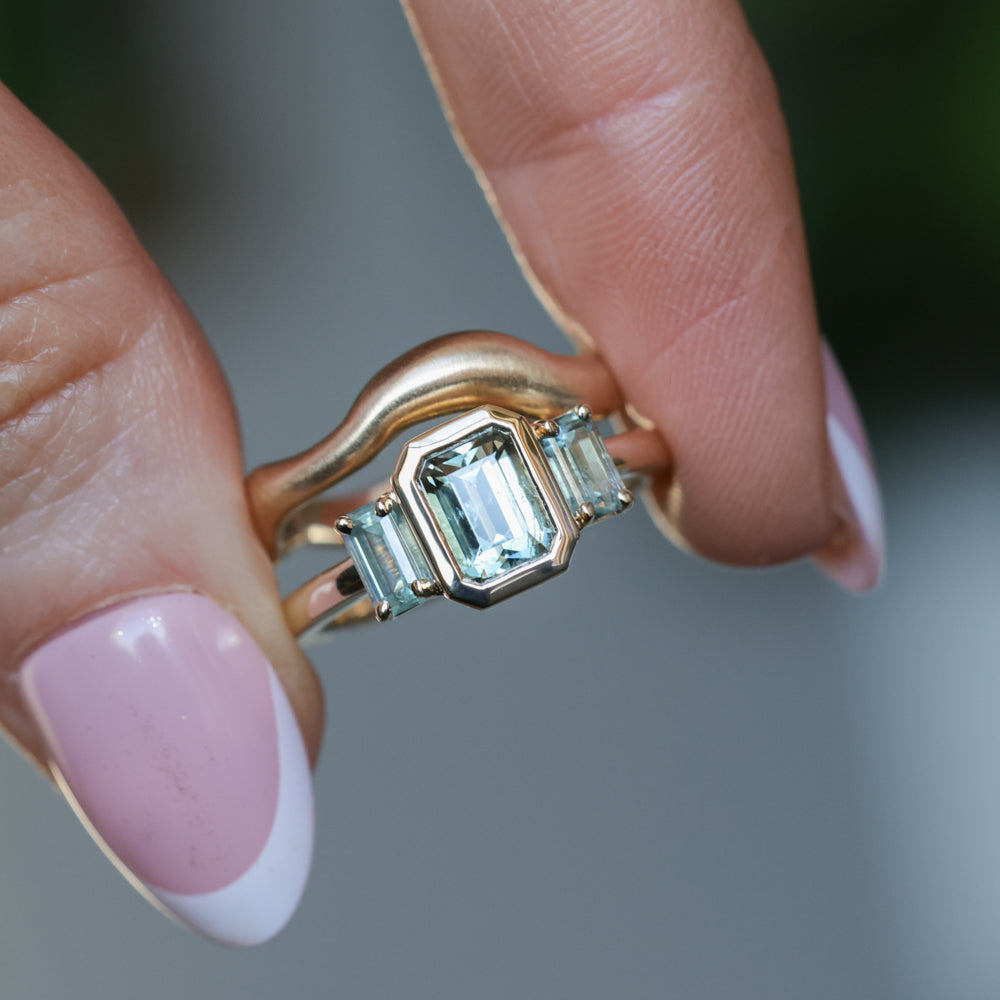 1.29ct Bezel Set Emerald Cut Untreated Montana Sapphire and Montana Sapphire Sides Three Stone Ring in 14k Yellow Gold