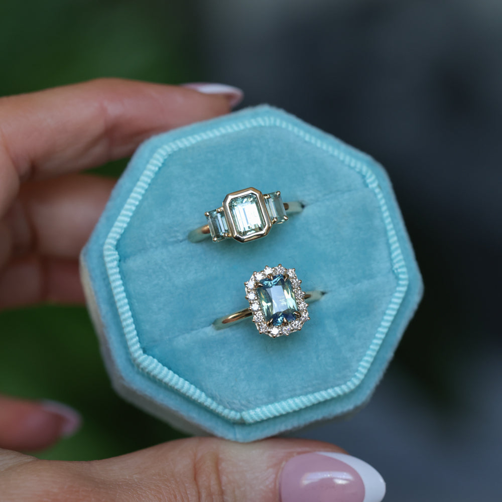 1.29ct Bezel Set Emerald Cut Untreated Montana Sapphire and Montana Sapphire Sides Three Stone Ring in 14k Yellow Gold