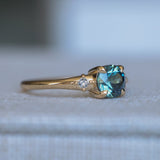 1.10ct Round Deep Teal Montana Sapphire and Princess Cut Diamond Rapids Low Profile Ring in 14k Yellow Gold