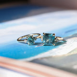1.35ct Oval Brilliant Montana Sapphire and Princess Cut Diamond Rapids Low Profile Ring in 14k Yellow Gold