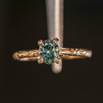 0.85ct Oval Precision Cut Ocean Blue Montana Sapphire Evergreen Carved 4 Prong Solitaire in 14k Yellow Gold