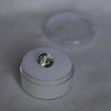 2.57CT FANCY PRECISION CUSHION MONTANA SAPPHIRE, PARTI OLIVE GREEN AND GOLD, 8.82X7.54X5.37MM - APPRAISED STONE