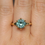 3.01ct Round GIA Teal Montana Sapphire Low Profile Six Prong Split Shank Solitaire in 18k Yellow Gold