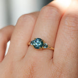 1.82ct Round Teal Precision Cut Montana Sapphire and Trillion Sapphire Low Profile Three Stone Ring in 18k Yellow Gold