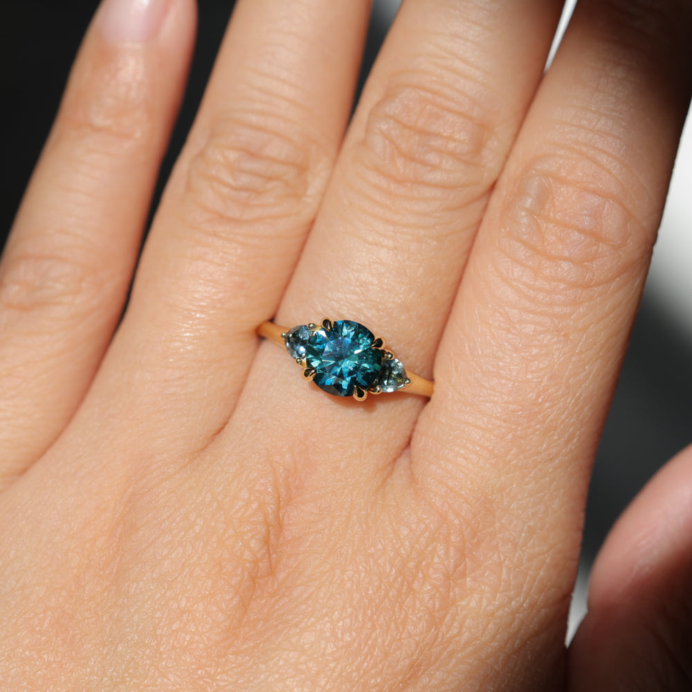 1.82ct Round Teal Precision Cut Montana Sapphire and Trillion Sapphire Low Profile Three Stone Ring in 18k Yellow Gold