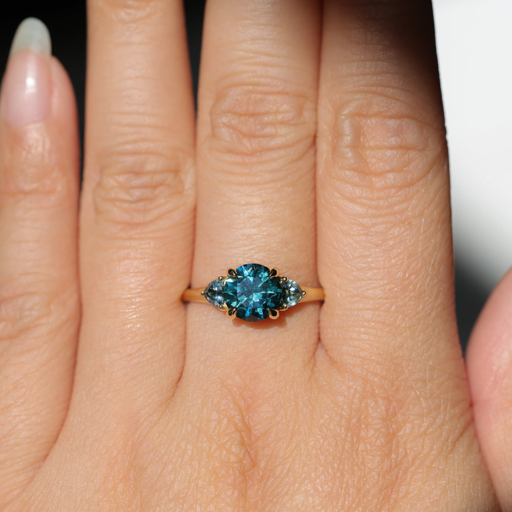 1.82ct Round Teal Precision Cut Montana Sapphire and Trillion Sapphire Low Profile Three Stone Ring in 18k Yellow Gold