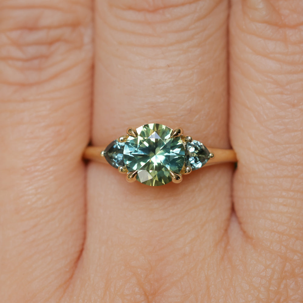 1.50ct Round Parti Yellow Blue Precision Cut Montana Sapphire and Trillion Sapphire Low Profile Three Stone Ring in 18k Yellow Gold
