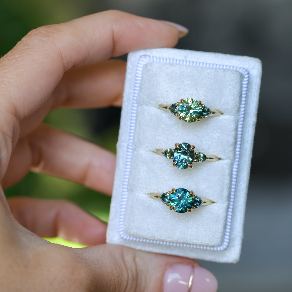 1.82ct Round Teal Precision Cut Montana Sapphire and Trillion Sapphire Low Profile Three Stone Ring in 18k Yellow Gold
