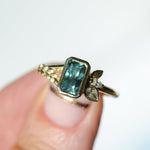1.45ct Untreated Montana Sapphire Wandering Vine Low Profile Bezel Ring with Pear Diamond in 18k Yellow Gold