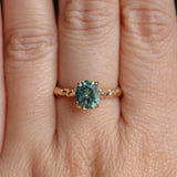 1.75ct Precision Cut Teal Oval Montana Sapphire Four Prong Evergreen Hidden Halo Solitaire in 14k Yellow Gold