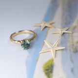 1.75ct Precision Cut Teal Oval Montana Sapphire Four Prong Evergreen Hidden Halo Solitaire in 14k Yellow Gold