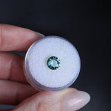 1.46CT ROUND PRECISION CUT MONTANA SAPPHIRE, TEAL GREEN, UNTREATED, 7.08X4.1MM