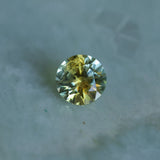 1.39CT ROUND PRECISION CUT MONTANA SAPPHIRE, BICOLOR YELLOW BLUE, 6.6X4.3MM