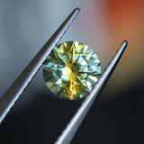 1.39CT ROUND PRECISION CUT MONTANA SAPPHIRE, BICOLOR YELLOW BLUE, 6.6X4.3MM