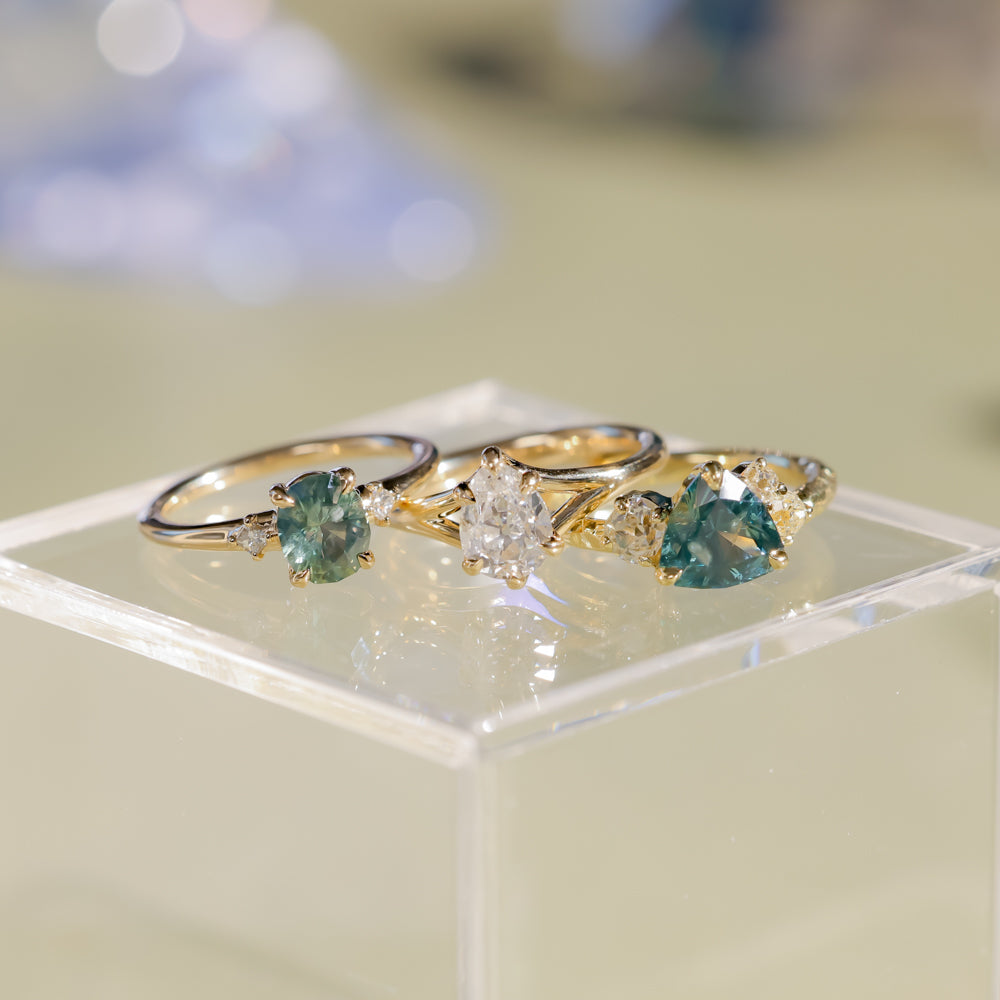 1.20ct Oval Brilliant Teal Montana Sapphire and Princess Cut Diamond Rapids Low Profile Ring in 14k Yellow Gold