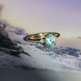 2.01ct Oval Precision Cut Denim Blue Untreated Montana Sapphire and Princess Cut Diamond Rapids Low Profile Ring in 18k Yellow Gold