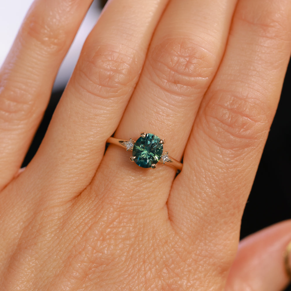 1.98ct Oval Precision Cut Teal Montana Sapphire and Princess Cut Diamond Rapids Low Profile Ring in 14k Yellow Gold