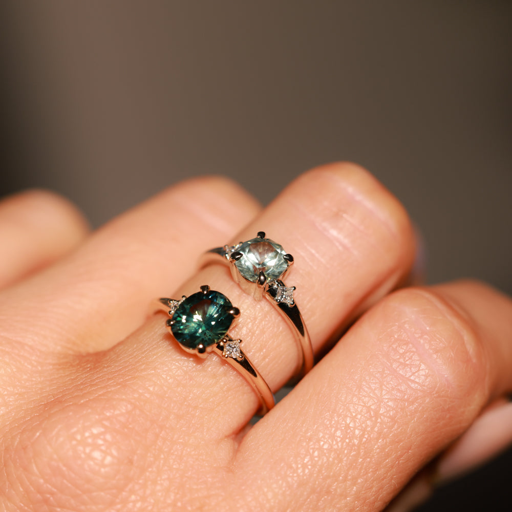 1.98ct Oval Precision Cut Teal Montana Sapphire and Princess Cut Diamond Rapids Low Profile Ring in 14k Yellow Gold