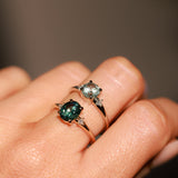 1.98ct Oval Precision Cut Teal Montana Sapphire and Princess Cut Diamond Rapids Low Profile Ring in 14k Yellow Gold