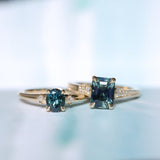 0.85ct Oval Deep Teal Montana Sapphire and Princess Cut Diamond Rapids Low Profile Ring in 14k Yellow Gold