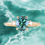 1.98ct Oval Precision Cut Teal Montana Sapphire and Princess Cut Diamond Rapids Low Profile Ring in 14k Yellow Gold