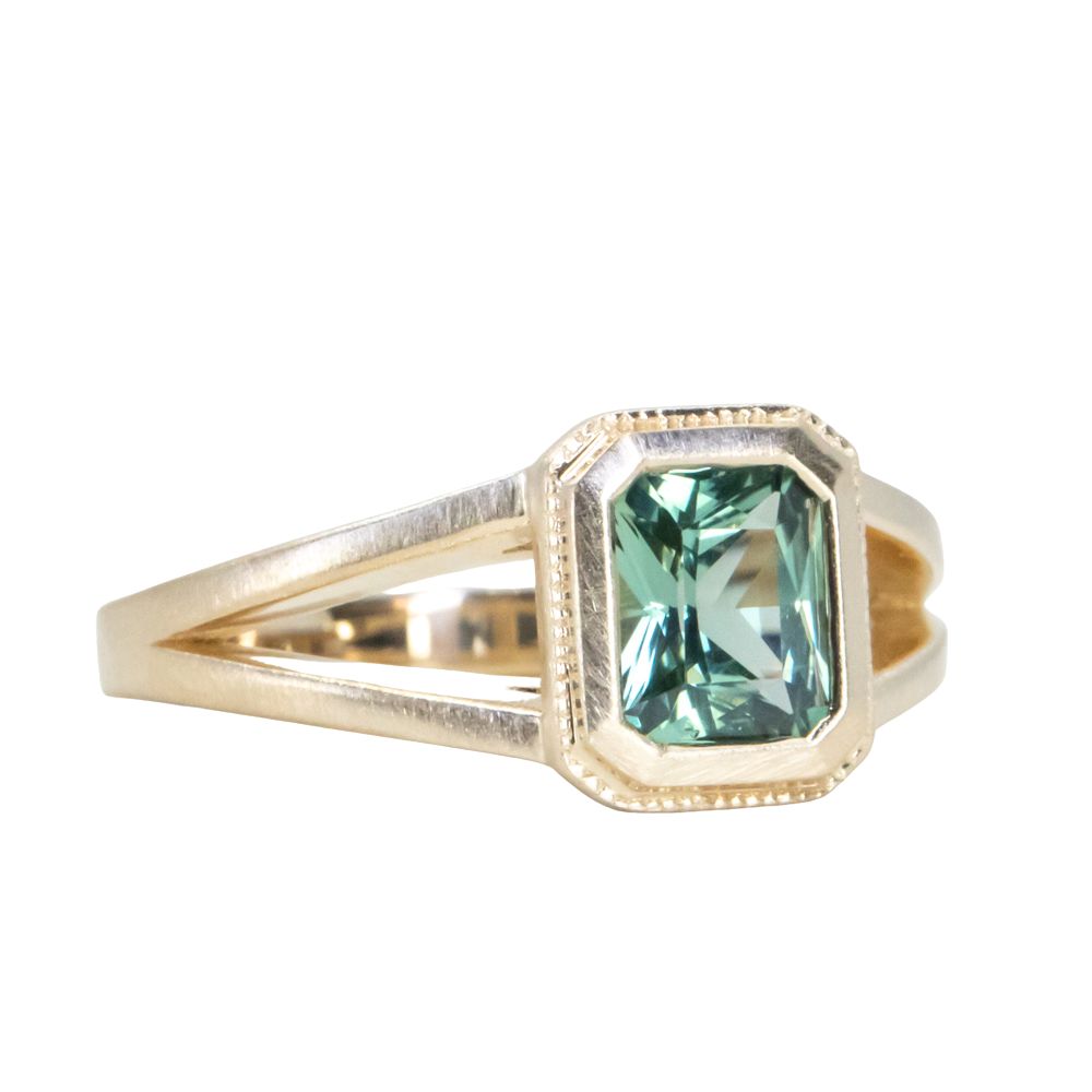 1.20ct Radiant Cut Seafoam Montana Sapphire Split Shank Bezel Ring with Milgrain in 14k Yellow Gold