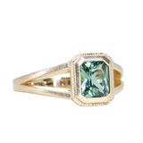 1.20ct Radiant Cut Seafoam Montana Sapphire Split Shank Bezel Ring with Milgrain in 14k Yellow Gold