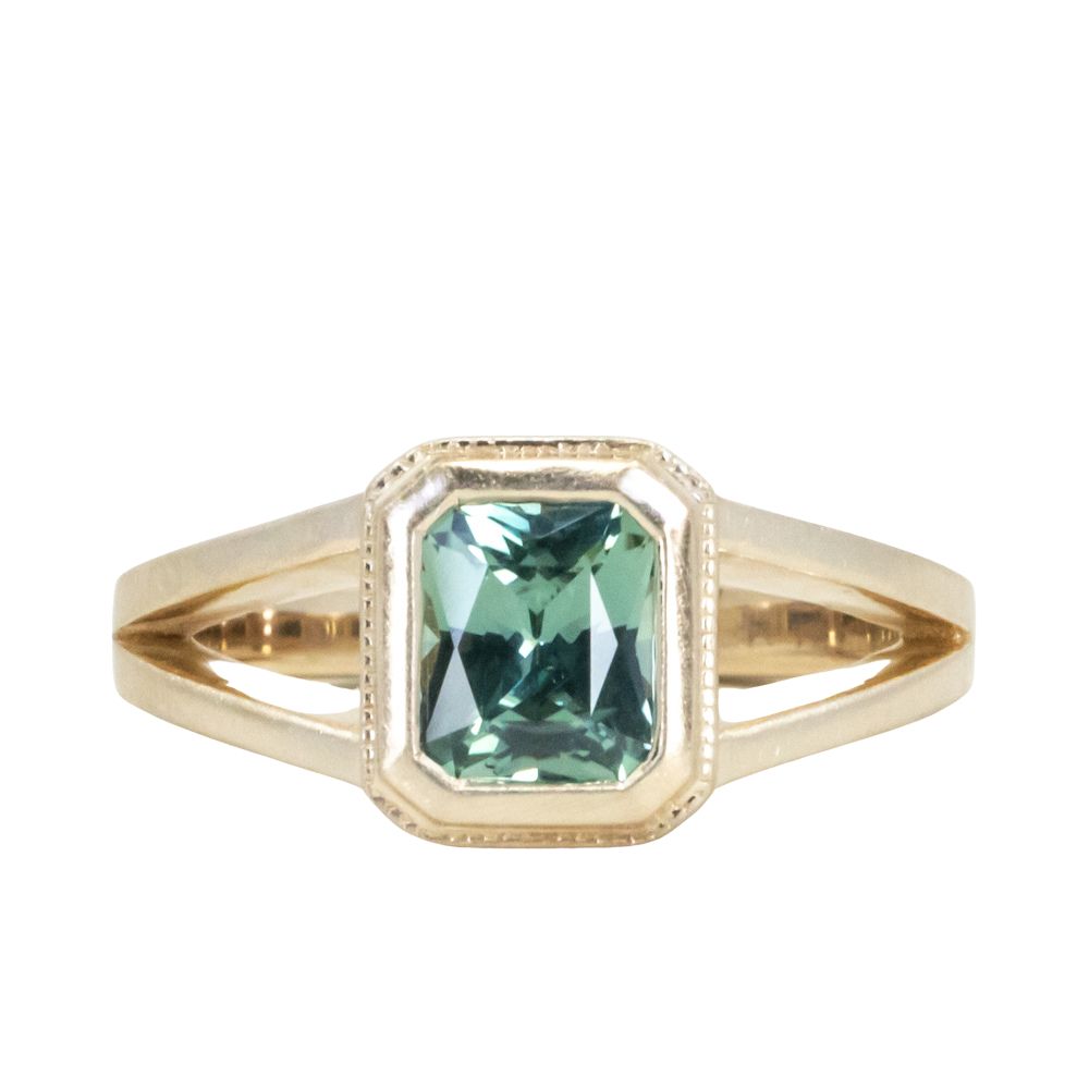 1.20ct Radiant Cut Seafoam Montana Sapphire Split Shank Bezel Ring with Milgrain in 14k Yellow Gold