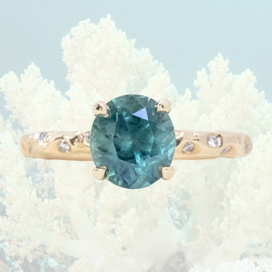 2.35ct Silky Roval Montana Sapphire 4 Prong Evergreen Solitaire with Scattered Embedded Diamonds in 14k Yellow Gold