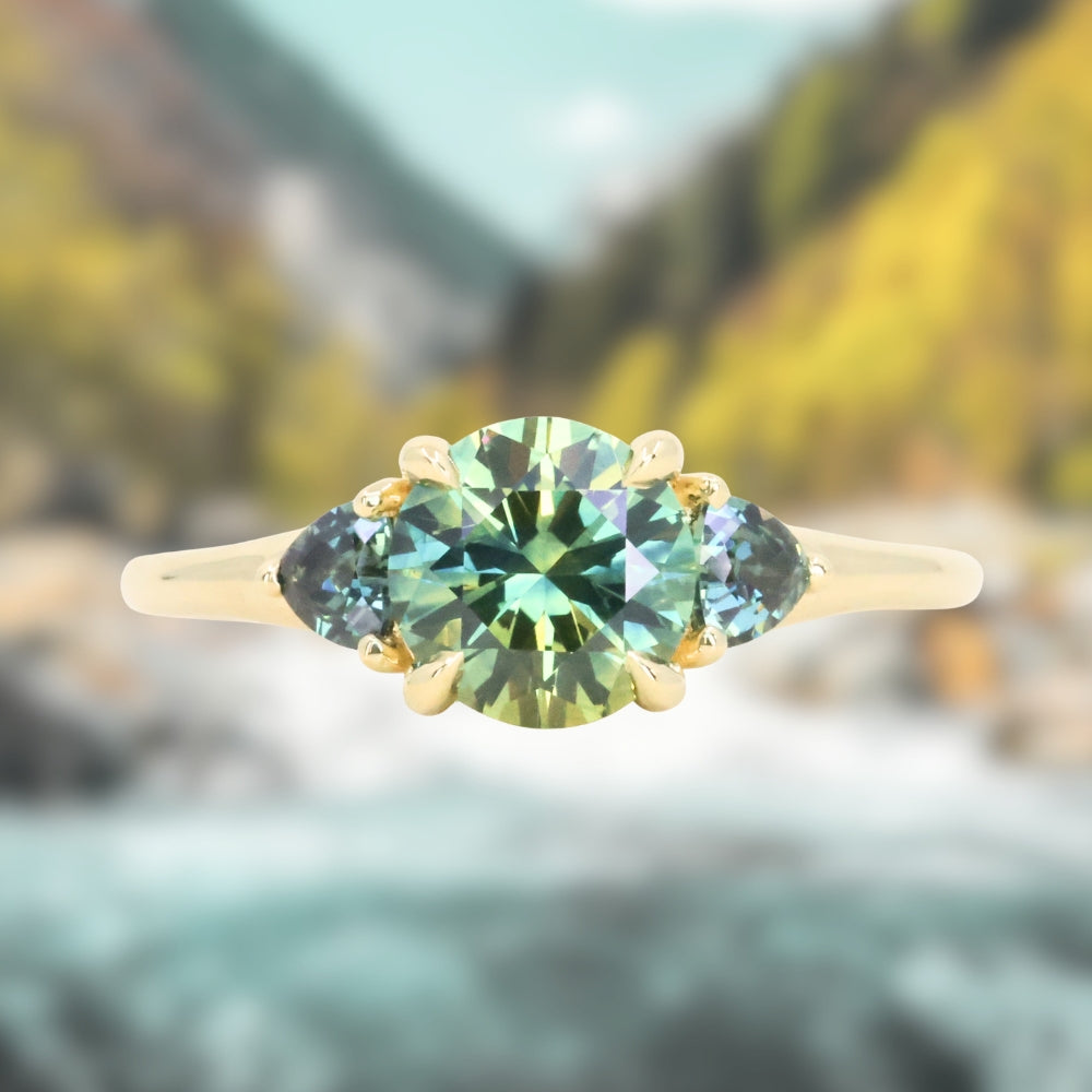 1.50ct Round Parti Yellow Blue Precision Cut Montana Sapphire and Trillion Sapphire Low Profile Three Stone Ring in 18k Yellow Gold
