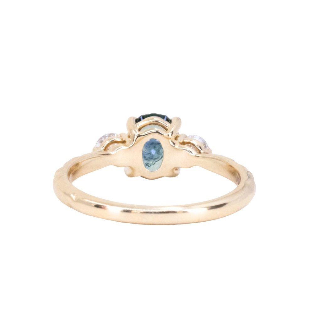 1.36ct Oval Montana Sapphire and Lab Diamond Three Stone Ring in 14K Yellow Gold with Evergreen Texture