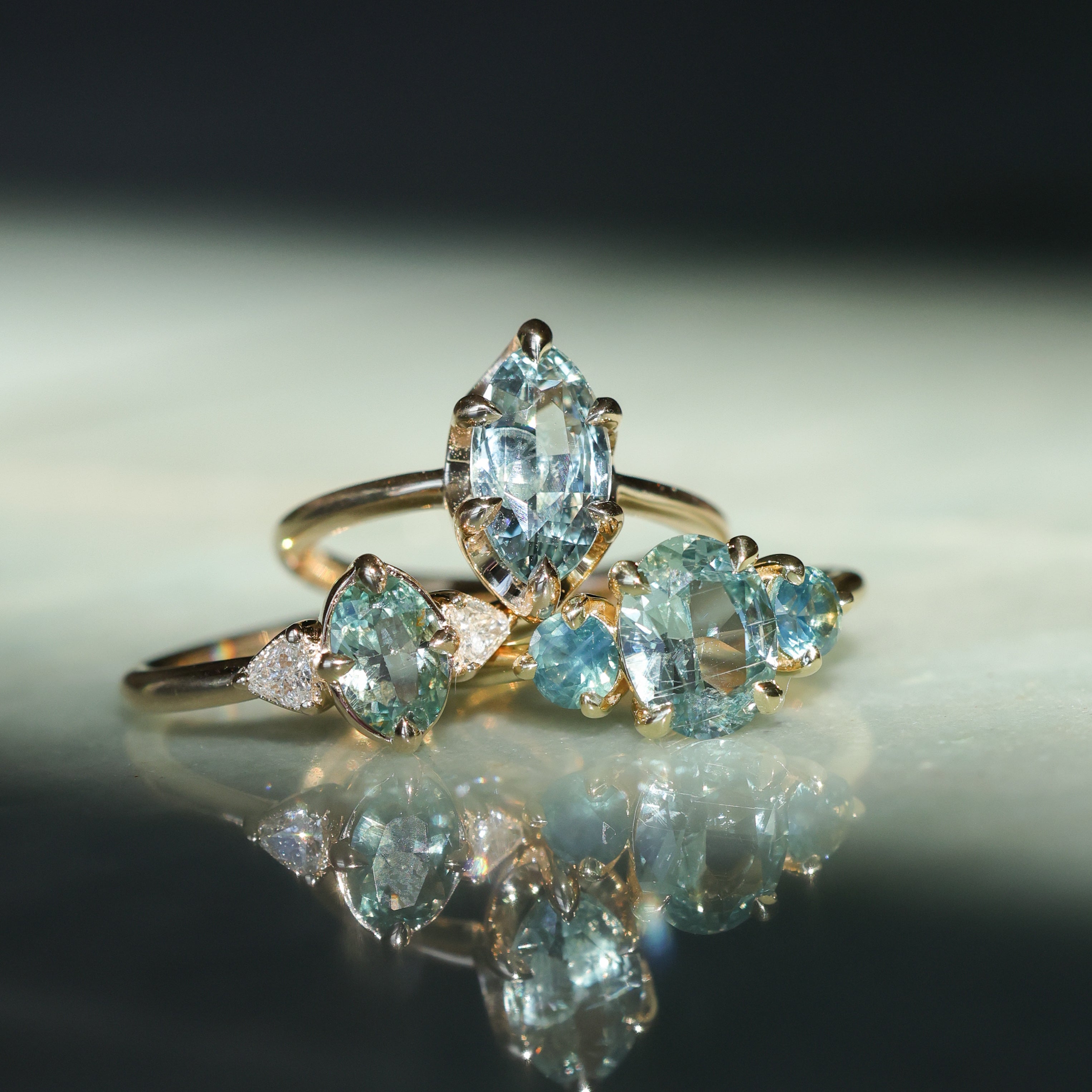 1.74ct Unheated Oval Montana Sapphire and Madagascar Sapphire Low Profile Three Stone Ring in 18k Yellow Gold