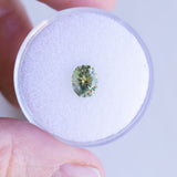 1.27CT PRECISION CUT OVAL MONTANA SAPPHIRE, OLIVE GREEN AND YELLOW, 6.89X5.84X4.36MM