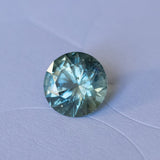 1.41CT ROUND PRECISION CUT MONTANA SAPPHIRE, PARTI MEDIUM TEAL BLUE WITH YELLOW GREEN, 6.8MM EARLY ACCESS